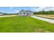 A beautiful green grass and blue skies on this home at 604 Highway 747, Loris, SC 29569