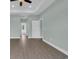 Hallway with hardwood floors, bright walls, and white doors at 604 Highway 747, Loris, SC 29569