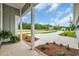 Relax on the porch with lush greenery and blue skies at 604 Highway 747, Loris, SC 29569