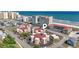 Aerial view showcasing the unique circular condo design, landscaping, nearby beach, and ocean views at 609 Hillside Dr. S # C-16, North Myrtle Beach, SC 29582