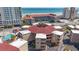 Aerial view showing condos' unique circular design near ocean with beach views, parking and a swimming pool nearby at 609 Hillside Dr. S # C-16, North Myrtle Beach, SC 29582