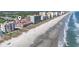 Stunning aerial view capturing the condo's location next to a beautiful beach, and neighboring resorts and amenities at 609 Hillside Dr. S # C-16, North Myrtle Beach, SC 29582