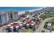 Aerial view highlighting the condos' circular layout, proximity to the beach, and surrounding coastal community at 609 Hillside Dr. S # C-16, North Myrtle Beach, SC 29582