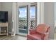 Cozy balcony with ocean views, accessible from the living area with comfortable seating at 609 Hillside Dr. S # C-16, North Myrtle Beach, SC 29582