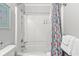 Bright bathroom offers a shower-tub combo with a patterned shower curtain at 609 Hillside Dr. S # C-16, North Myrtle Beach, SC 29582