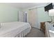 Airy bedroom featuring a sliding barn door, television and a relaxing ambiance at 609 Hillside Dr. S # C-16, North Myrtle Beach, SC 29582