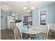 Cozy dining area with seating for four, adjacent to the kitchen and living room at 609 Hillside Dr. S # C-16, North Myrtle Beach, SC 29582