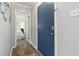 Inviting entryway with a blue front door leading to a bedroom with light green walls at 609 Hillside Dr. S # C-16, North Myrtle Beach, SC 29582