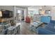 Inviting living room with beachy decor, wood floors, and access to a private balcony at 609 Hillside Dr. S # C-16, North Myrtle Beach, SC 29582