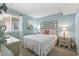 Cozy main bedroom with decorative headboard and a relaxing coastal theme at 609 Hillside Dr. S # C-16, North Myrtle Beach, SC 29582