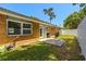 Backyard view of home, showing patio, grill, and privacy fence at 617 Hibiscus Ave. # 617, Myrtle Beach, SC 29577