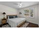 This bedroom features a ceiling fan, a comfy bed, and a window for natural light at 617 Hibiscus Ave. # 617, Myrtle Beach, SC 29577