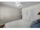 This bedroom features a ceiling fan, a comfy bed, and an ensuite bathroom at 617 Hibiscus Ave. # 617, Myrtle Beach, SC 29577