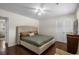 Well-lit bedroom with ceiling fan, hardwood floor, and a large bed at 617 Hibiscus Ave. # 617, Myrtle Beach, SC 29577