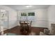 Dining area featuring hardwood floors, a window, and seating for four people, perfect for Gathering meals at 617 Hibiscus Ave. # 617, Myrtle Beach, SC 29577