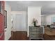 Inviting entryway with hardwood floors, complemented by a decorative chest and view into the living area at 617 Hibiscus Ave. # 617, Myrtle Beach, SC 29577