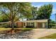 Beautiful one-story home with brick and siding and a large shade tree in the front yard at 617 Hibiscus Ave. # 617, Myrtle Beach, SC 29577