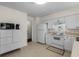 Bright kitchen features white appliances, tile floor, and plenty of cabinet space at 617 Hibiscus Ave. # 617, Myrtle Beach, SC 29577