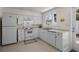 Kitchen features white cabinets, appliances and a window for natural light at 617 Hibiscus Ave. # 617, Myrtle Beach, SC 29577