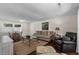 Cozy living room with a comfortable seating arrangement and a jute rug over hardwood flooring at 617 Hibiscus Ave. # 617, Myrtle Beach, SC 29577