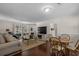 Open-concept living space featuring hardwood floors, comfortable seating, and a view into the dining area at 617 Hibiscus Ave. # 617, Myrtle Beach, SC 29577