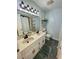 Bright bathroom features double sink vanity, modern lighting fixtures, and ample storage space at 625 North Waccamaw Dr. # 101, Murrells Inlet, SC 29576