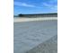 Expansive beach view with a picturesque pier in the distance at 625 North Waccamaw Dr. # 101, Murrells Inlet, SC 29576