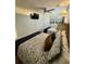 Well-lit bedroom with two beds featuring stylish patterned bedding, modern lighting, and beach-themed decor at 625 North Waccamaw Dr. # 101, Murrells Inlet, SC 29576