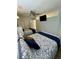 Cozy bedroom features two beds with stylish patterned bedding, ceiling fan and a wall-mounted television at 625 North Waccamaw Dr. # 101, Murrells Inlet, SC 29576