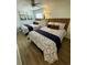 Comfortable bedroom featuring two beds with stylish patterned bedding and beach-themed decor at 625 North Waccamaw Dr. # 101, Murrells Inlet, SC 29576