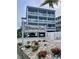 Whispering Sands condos featuring beachy landscaping and building with first level covered parking at 625 North Waccamaw Dr. # 101, Murrells Inlet, SC 29576