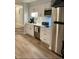 A contemporary kitchen with white cabinets, stainless steel appliances, and modern touches at 625 North Waccamaw Dr. # 101, Murrells Inlet, SC 29576
