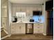 A modern kitchen with white cabinets, stainless steel appliances, and a clean countertop at 625 North Waccamaw Dr. # 101, Murrells Inlet, SC 29576