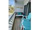 Relaxing patio with comfortable bench, hooks and colorful furniture, perfect for enjoying the outdoors at 625 North Waccamaw Dr. # 101, Murrells Inlet, SC 29576