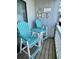 Charming patio area features blue chairs and nautical decor, creating a relaxing outdoor space at 625 North Waccamaw Dr. # 101, Murrells Inlet, SC 29576