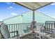 This balcony provides a cozy outdoor space with chairs and a table to relax and enjoy the view at 6302 N Ocean Blvd. # G-3, North Myrtle Beach, SC 29582