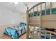 Comfortable bedroom featuring a bunk bed, twin bed, and beach-themed decor at 6302 N Ocean Blvd. # G-3, North Myrtle Beach, SC 29582