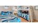 Charming bedroom with a bunk bed, twin bed, and colorful nautical-themed bedding at 6302 N Ocean Blvd. # G-3, North Myrtle Beach, SC 29582