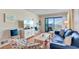 Inviting living room with beach-inspired decor, balcony access, and comfortable seating at 6302 N Ocean Blvd. # G-3, North Myrtle Beach, SC 29582
