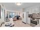 Cozy living room with balcony access, comfortable seating and open to the kitchen and dining area at 6302 N Ocean Blvd. # G-3, North Myrtle Beach, SC 29582