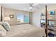 Cozy bedroom with four-poster bed, ceiling fan, and a window overlooking the neighborhood at 6302 N Ocean Blvd. # G-3, North Myrtle Beach, SC 29582