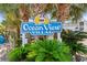 Ocean View Villas community sign surrounded by palm trees and lush greenery at 6302 N Ocean Blvd. # G-3, North Myrtle Beach, SC 29582
