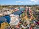 Aerial view of a vibrant entertainment district with a large Ferris wheel, water features, and colorful buildings at 6734 Blue Heron Blvd. # 104, Myrtle Beach, SC 29588