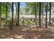 Enjoy the serene backyard with mature trees, offering a private outdoor retreat for relaxation and entertainment at 6734 Blue Heron Blvd. # 104, Myrtle Beach, SC 29588
