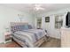 Bright bedroom with wood-look floors, decorative accents, and two windows at 6734 Blue Heron Blvd. # 104, Myrtle Beach, SC 29588