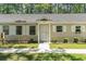 Charming single story home with well-manicured lawn and walkway leading to a front door with sidelight at 6734 Blue Heron Blvd. # 104, Myrtle Beach, SC 29588