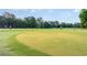 Golf course view with lush green grass, trees, and golfers in the background, perfect for scenic enjoyment at 6734 Blue Heron Blvd. # 104, Myrtle Beach, SC 29588