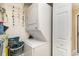 Laundry room featuring a stacked washer and dryer unit and a storage shelf at 6734 Blue Heron Blvd. # 104, Myrtle Beach, SC 29588