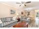 Open-concept living space with comfortable seating and access to the dining area at 6734 Blue Heron Blvd. # 104, Myrtle Beach, SC 29588