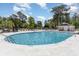 Large community pool for residents' enjoyment, surrounded by ample seating and beautiful landscaping at 6734 Blue Heron Blvd. # 104, Myrtle Beach, SC 29588